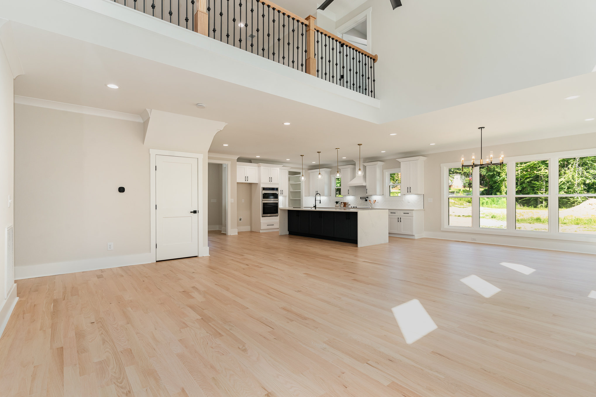Finished custom home interior with open living room and kitchen
